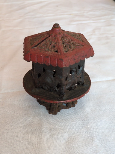 Cast iron carousel coin bank with rotating mechanism, reproduction of 1875 patent design