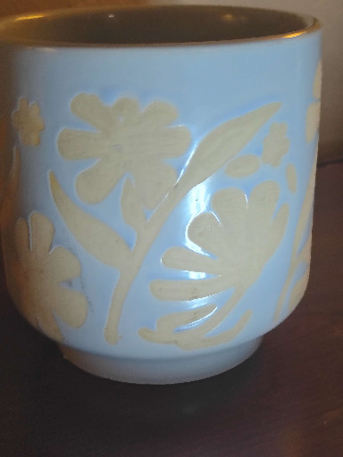 Ceramic planter or cachepot with blue glaze and white floral relief decoration