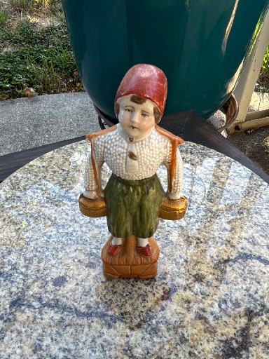 Bisque porcelain figurine titled 'Dutch Boy Water Carrier', made in Germany