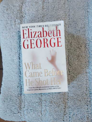 Paperback book titled 'What Came Before He Shot Her' by Elizabeth George