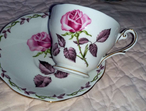 Fine bone china teacup and saucer set titled 'Rose Marie' by Royal Standard