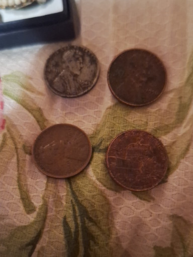 Four circulated Lincoln Wheat Cents (pennies)