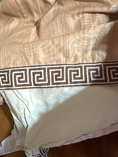 Textile home decor item, likely a curtain valance or decorative throw with Greek key trim