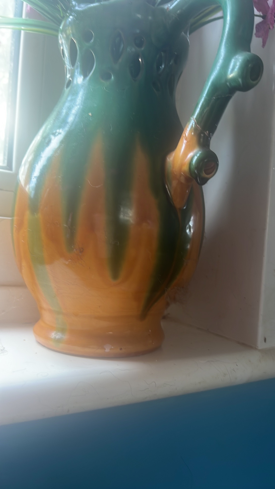 Ceramic puzzle pitcher with reticulated design