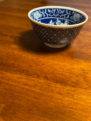 Porcelain rice bowl with blue and white geometric and floral decoration