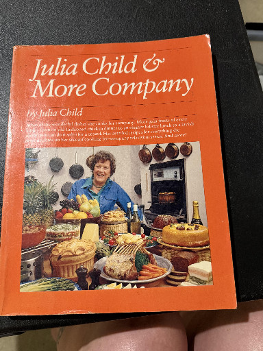 Hardcover cookbook titled 'Julia Child & More Company' by Julia Child, 1980 seasonal edition