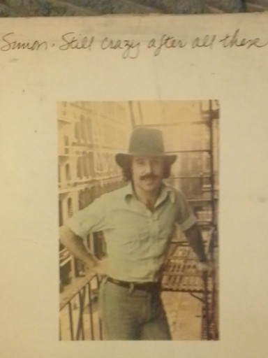 Vintage photograph with handwritten inscription 'Simon - Still crazy after all these years'