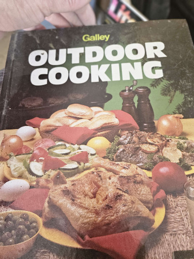 Hardcover cookbook titled 'Outdoor Cooking' published by Galley
