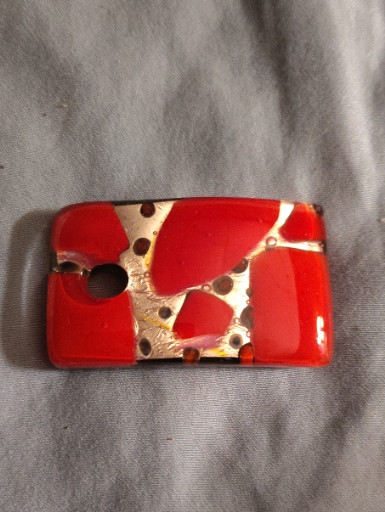 Murano glass pendant with gold foil and millefiori technique in red