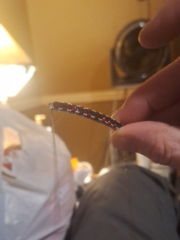 Sterling silver bracelet with channel-set red garnets marked '925 STS'