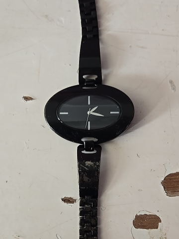 Black-plated steel fashion watch with oval case and chain-link bracelet