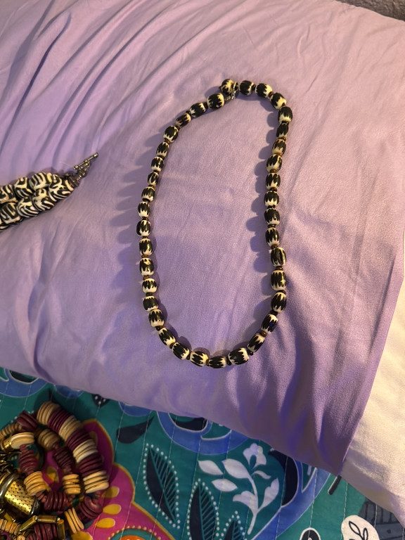 Batik-patterned bone trade bead necklace with brass spacers