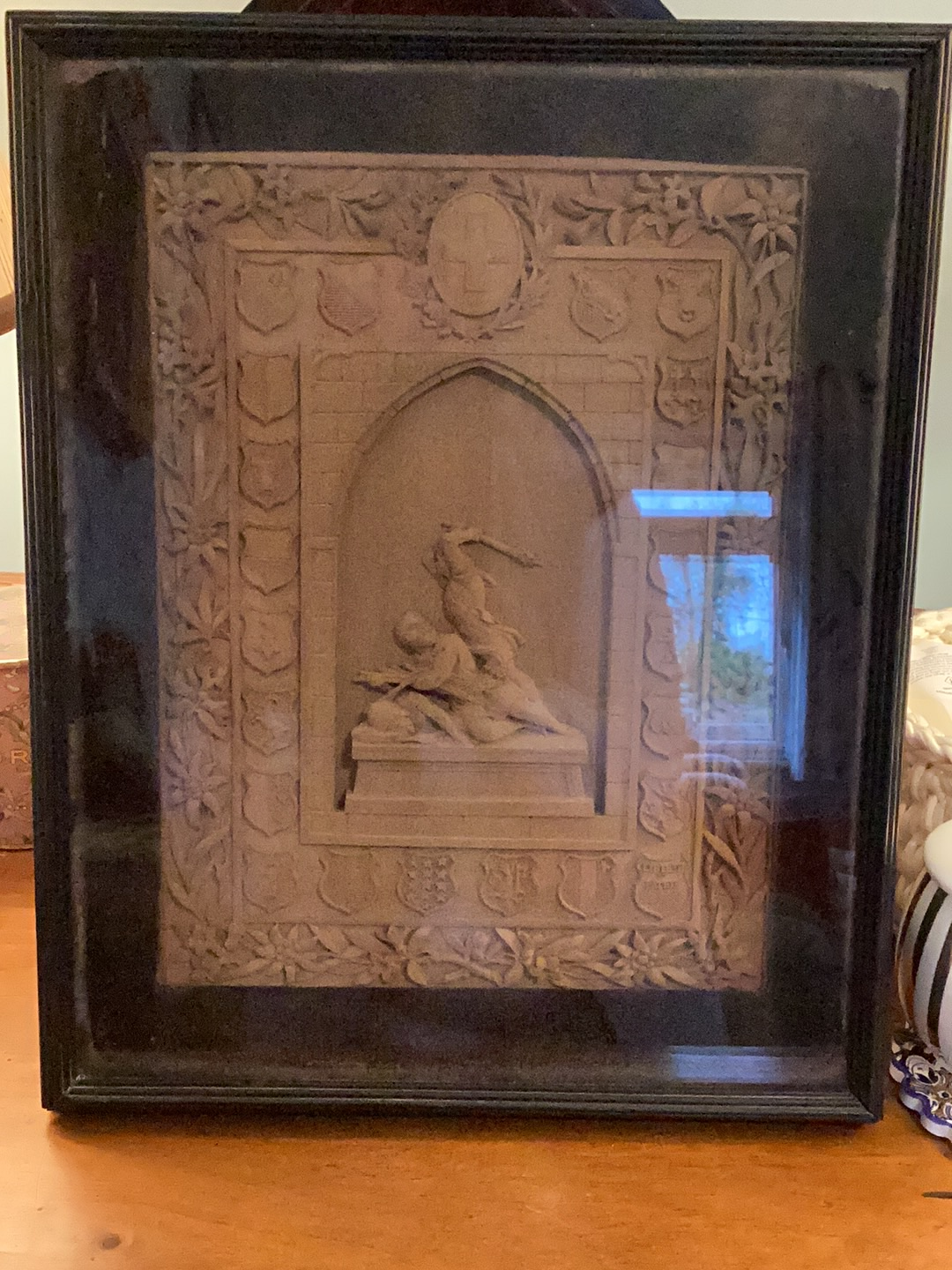 Plaster relief sculpture depicting 'Liberty and Patrie' in Gothic architectural frame with heraldic shields