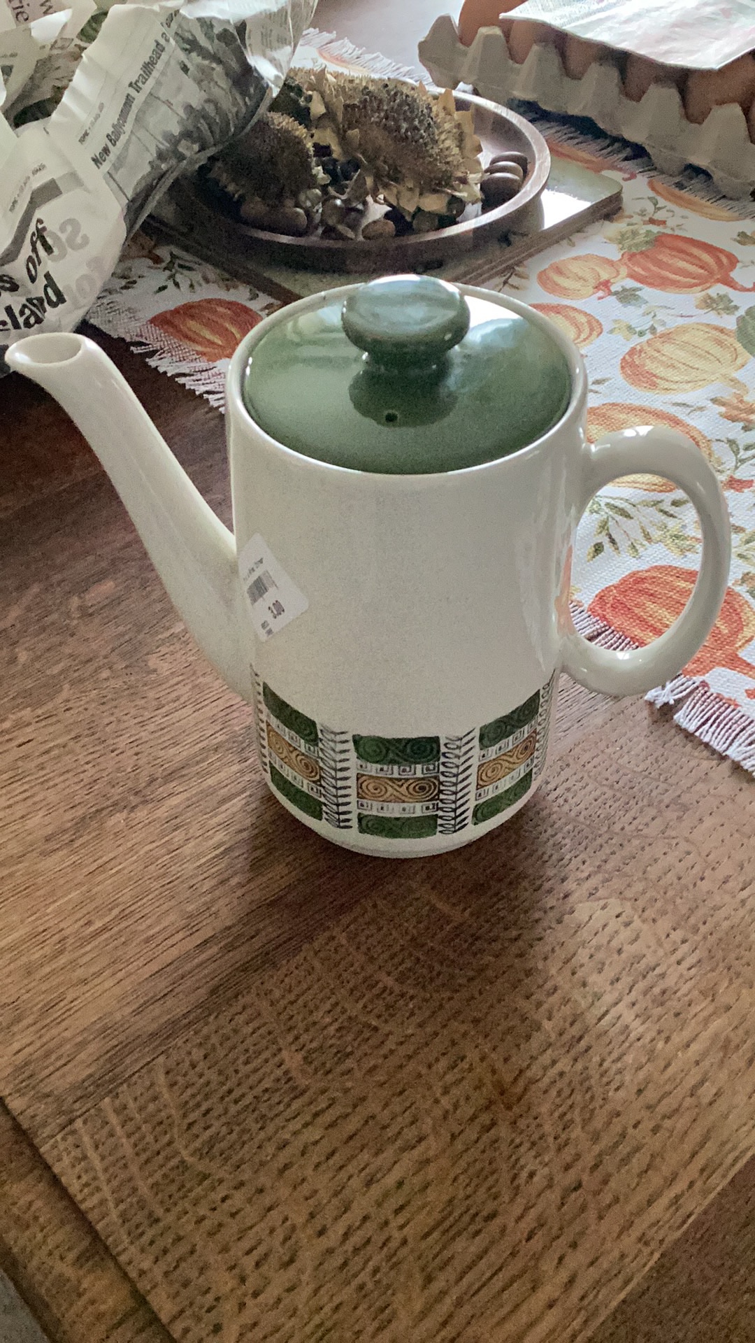 Ceramic coffee pot with geometric pattern and green lid
