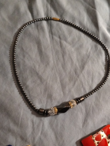 Hematite bead necklace with decorative gold-tone accents