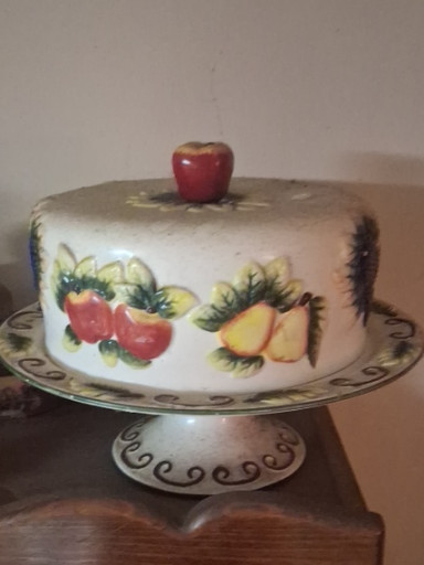 Porcelain covered cake stand with embossed fruit decoration