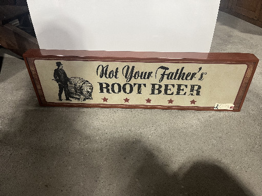 Vintage advertising sign for 'Not Your Father's Root Beer' by Small Town Brewery