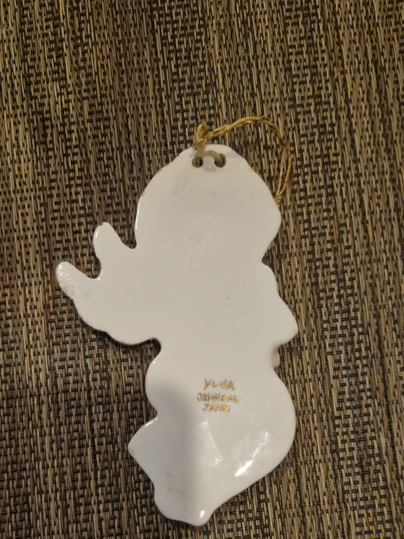 Ceramic Christmas ornament of an angel playing a banjo, made in Japan