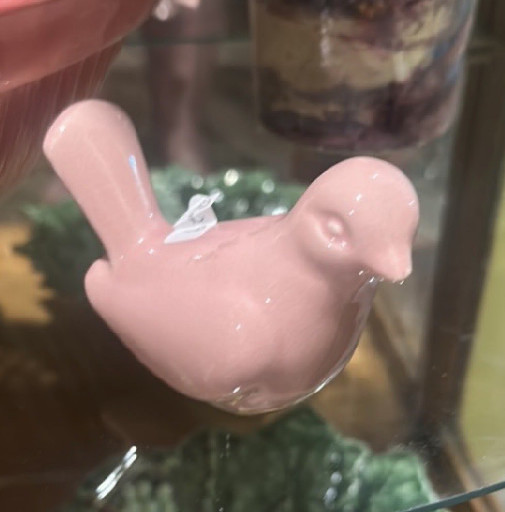 Glazed ceramic bird figurine in pink