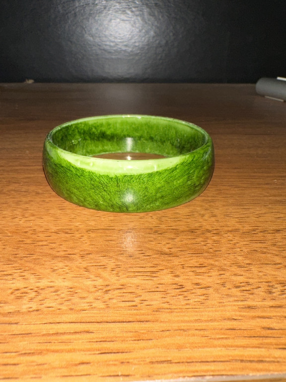 Bakelite or resin bangle bracelet in green and yellow marbleized pattern
