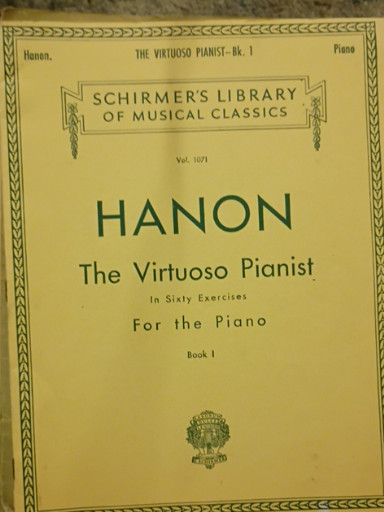 Sheet music book titled 'The Virtuoso Pianist' by Charles-Louis Hanon, published by Schirmer's Library of Musical Classics
