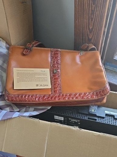 Leather handbag with crocodile-embossed trim by Brahmin. Designer John Romain