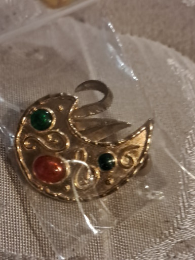 Gold-tone metal brooch with red and green cabochon stones