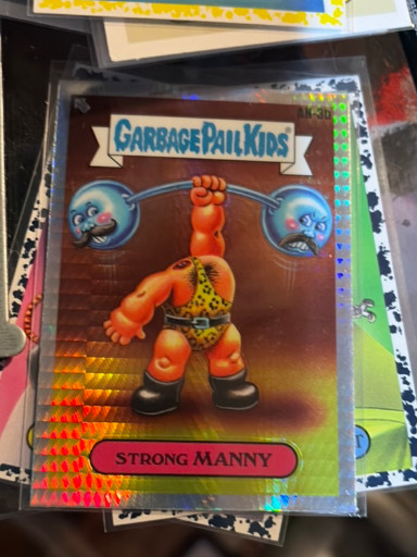 2024 Topps Chrome Garbage Pail Kids Series 7 trading card titled 'Strong Manny' (#AN-3b), Purple Refractor parallel