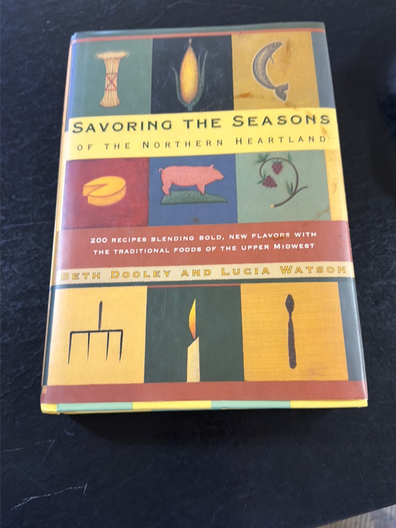 Signed hardcover cookbook titled 'Savoring the Seasons of the Northern Heartland' by Beth Dooley and Lucia Watson