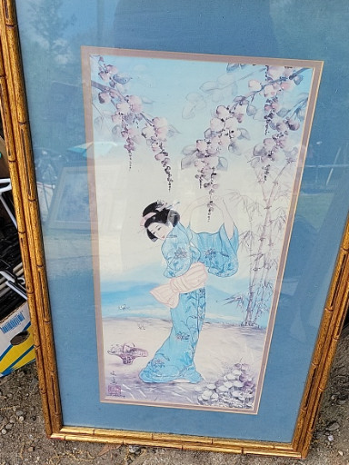 Reproduction print of a Japanese geisha under wisteria blossoms