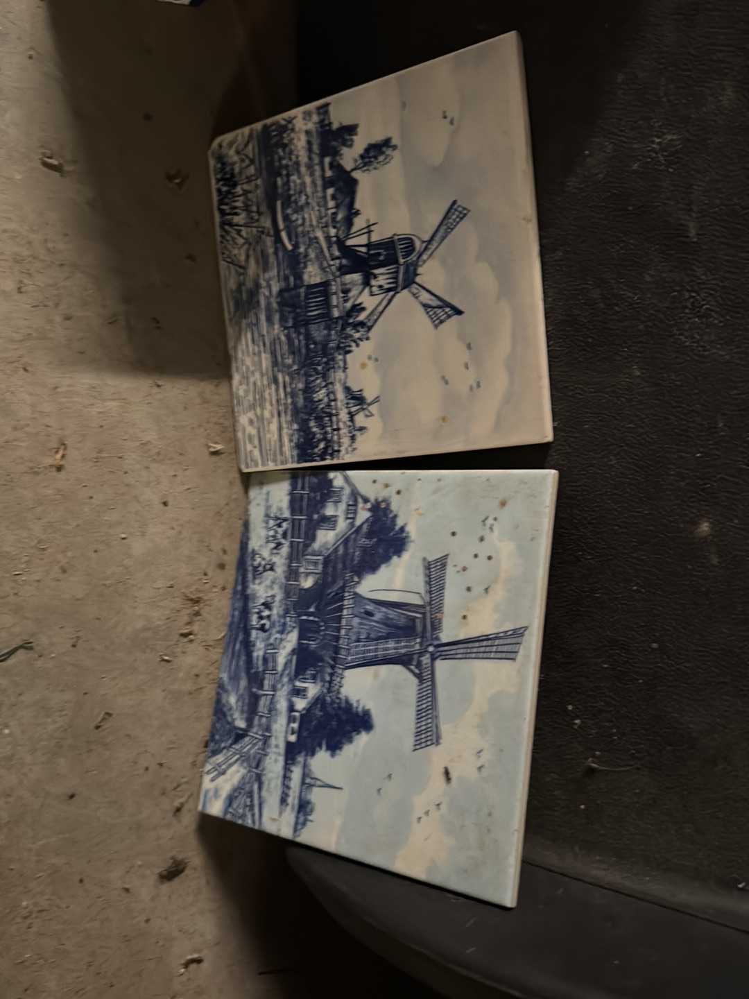 Delft blue ceramic tiles depicting Dutch windmill scenes, made in Holland