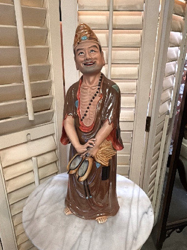 Porcelain figurine depicting Ji Gong, the Mad Monk. Shiwan, Guangdong Province, China.