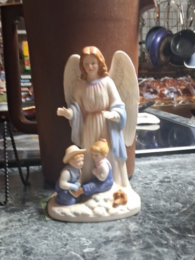 Porcelain figurine titled 'Guardian Angel with Denim Days Children' #8822 by Home Interiors