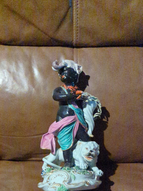 Porcelain figurine titled 'Africa' from the Four Continents series by Derby Porcelain