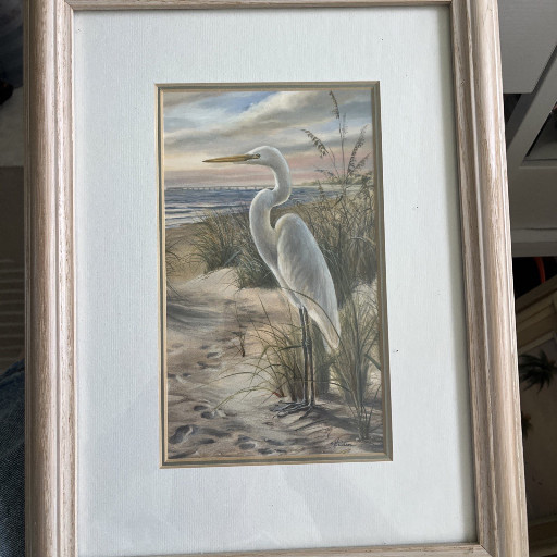 Framed decorative print titled 'White Heron on Beach' or 'Great Egret at Shore'