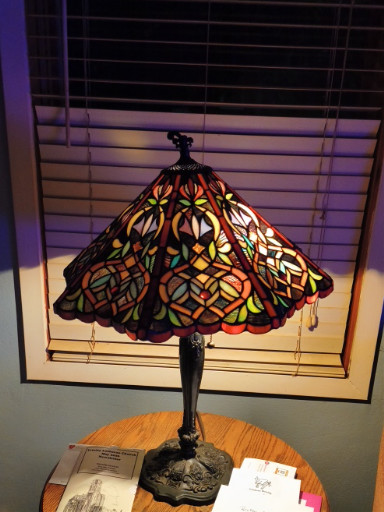 Tiffany-style stained glass table lamp with floral poinsettia pattern