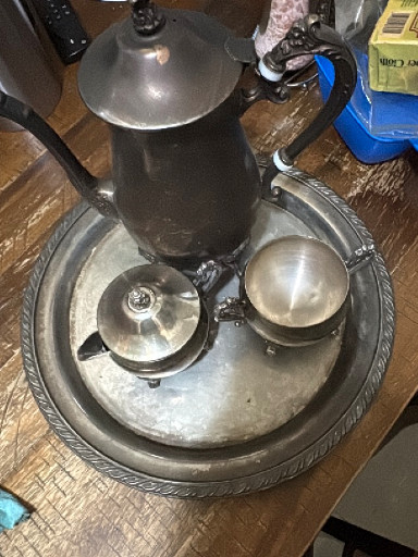 Silver-plated tea or coffee service set with tray, teapot, creamer, and sugar bowl