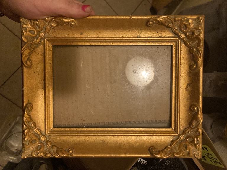 Ornate gilded wood picture frame with decorative corner and side embellishments