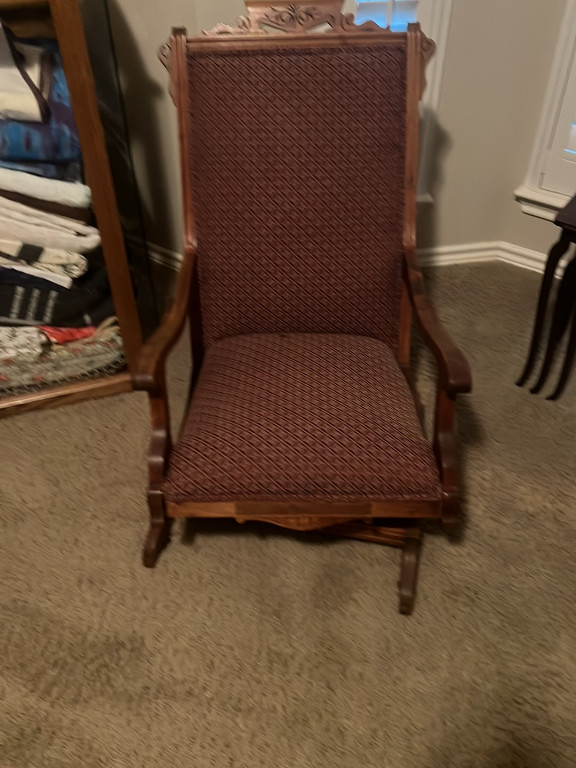 Victorian-style wooden platform rocking chair with upholstered fabric seat and back