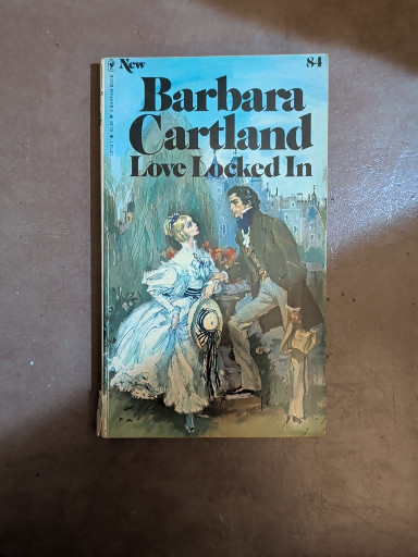 Paperback romance novel titled 'Love Locked In' by Barbara Cartland