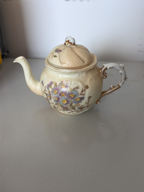 Porcelain teapot with hand-painted floral decoration and gold trim