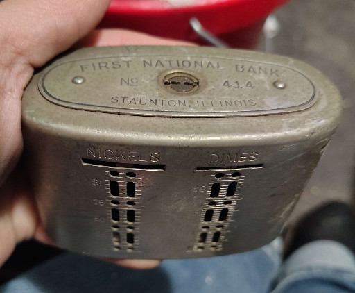 Metal coin bank from First National Bank, Staunton, Illinois