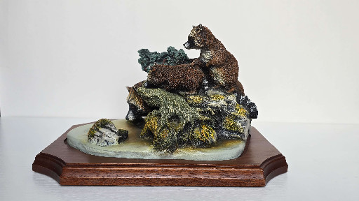 Resin sculpture titled 'First Course' depicting a raccoon family by Bonssons/Fraser Art