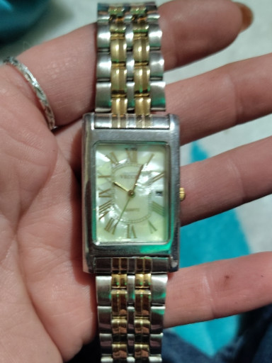 Two-tone stainless steel rectangular quartz wristwatch with Roman numeral dial