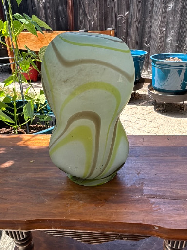 Art glass vase with swirled green and yellow marbled pattern