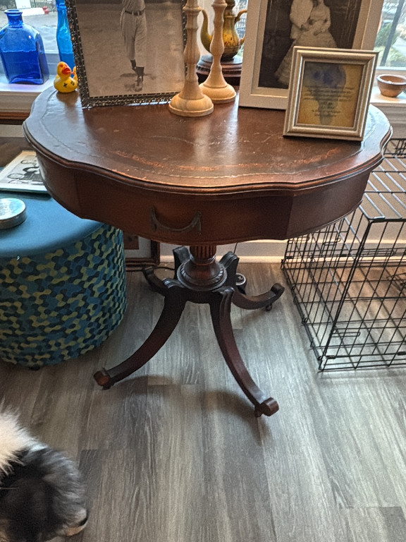 Mahogany drum table with leather top in Federal Revival style by Mersman Furniture