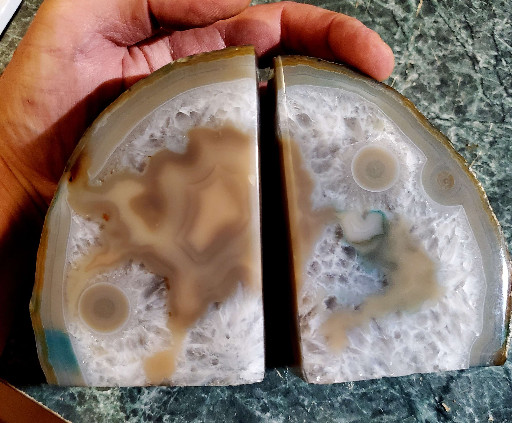 Polished agate geode bookends with natural banding and druzy formations