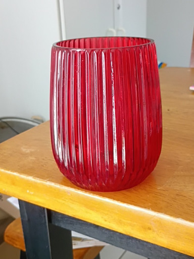 Red ribbed glass candle holder or votive