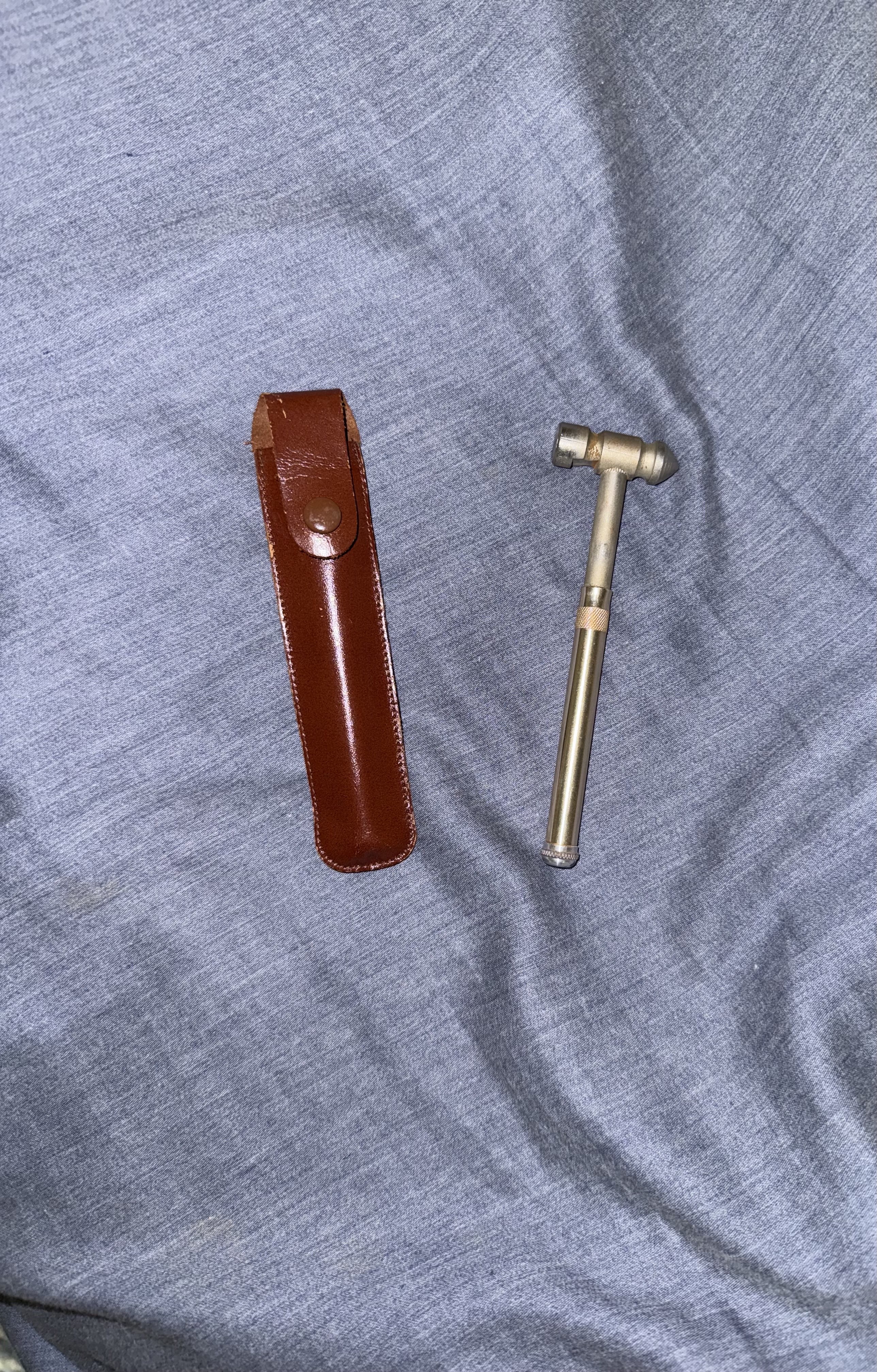 Brass telescoping percussion hammer with leather case