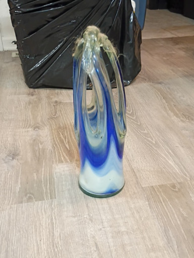 Murano-style blown glass vase with blue and clear swirled design